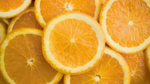 Juicy Ripe Orange Fruit Cut Into Slices Orange Fruit Slices Spinning for Background