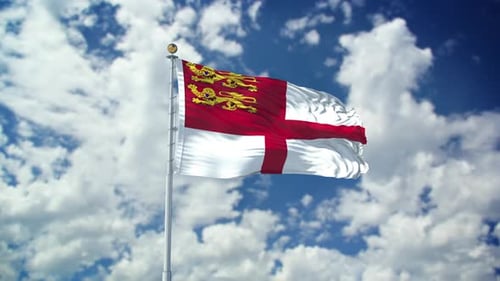 Waving Flag of Jersey on a Cloudy Blue Sky