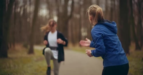 Two Woman Workout Exercising In Park Jogging Fitness