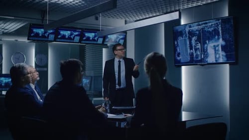 Business Team Meeting at a Futuristic Command Center