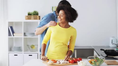 Couple Preparing Food Together in a Kitchen