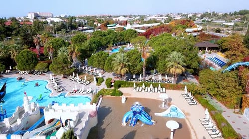 Aerial View of the Aqua Park with Large Pools and Slides in a Luxury Beach Resort