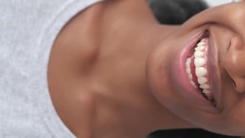 Smiling Woman Displays Perfect Teeth in Close Up