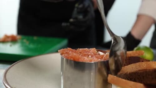 Chef Prepares Salmon Tartare with Toast