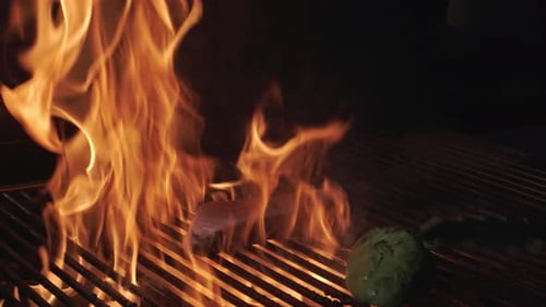 Cooking salmon filet and avocado on the grill grate