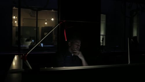 Dedicated Businessman Working Late at Computer in Dark Office 5054 Years