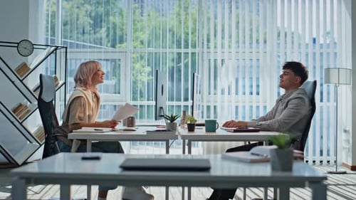 Professionals Working in a Bright Modern Office