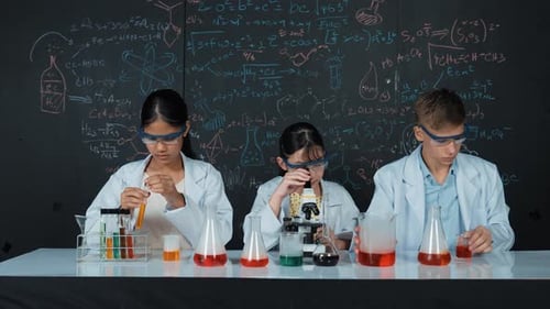 Students Conduct Science Experiment in Lab with Microscope