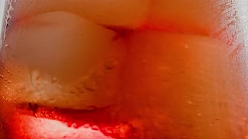 Icy Red Drink with Ice Cubes Close-up