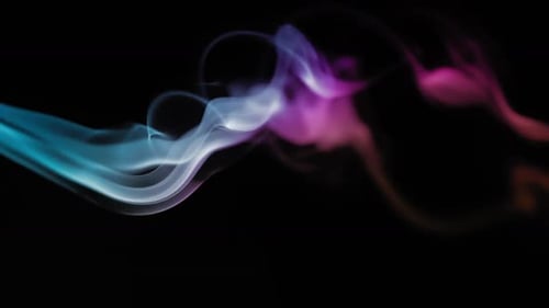 Colorful Smoke Flowing on a Black Background
