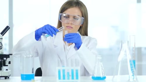 Scientist mixes chemicals in the laboratory