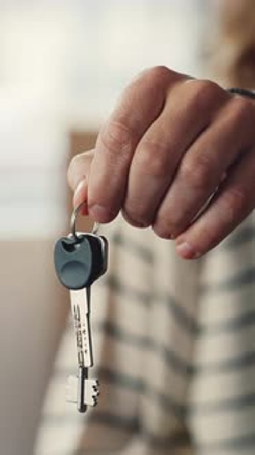 Close Up of Hand Holding House Keys Indoors