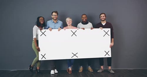 Five Smiling People Holding a White Sign