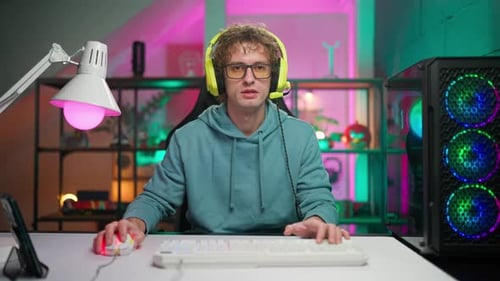 Young Adult Gamer Playing Video Game Indoors