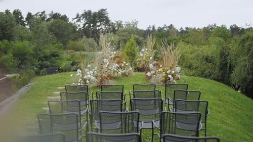 Wedding Ceremony Setup With Flowers and Chairs