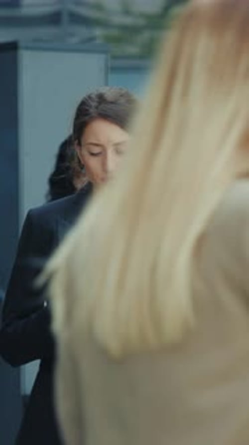 Young Woman Using Phone in Urban Setting