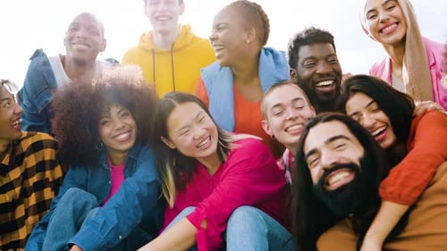 Smiling Young Adults Together in Daylight