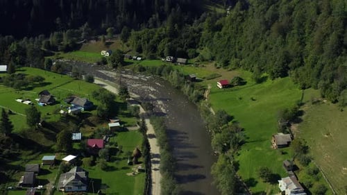 Aerial Small Mountain Village Among Vivid Green Trees Warm Summer Sunny Day