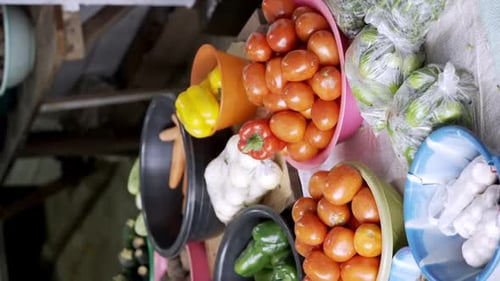 Vertical View Of Fresh Fruits And Vegetables Selling In The African Market. Pan Left Shot