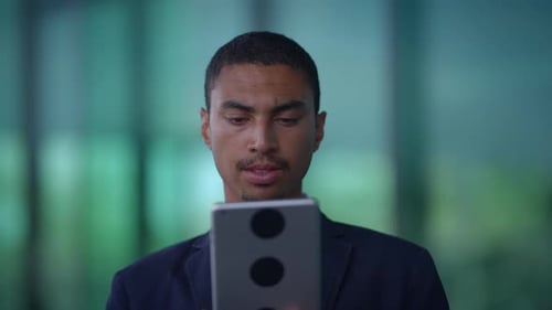 Young Adult Using Tablet in Office Setting