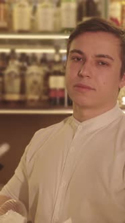 Man Holding Napkin in the Bar and Looking at you