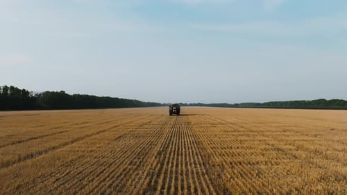 Aerial View of Farmer Fertilizing Agricultural Field Spreading Mineral Fertilizer in Slow Motion