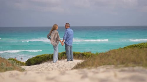 Romantic Middleaged Couple Enjoying a Peaceful Evening Together on the Beach Love Connection and