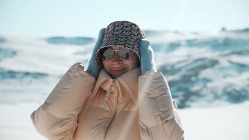 Smiling Woman in Mountains in Winter