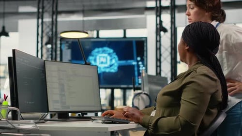 Team of Technicians in Office Working Together Automating Workflows Using AI