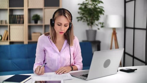 Woman Working From Home in Virtual Meeting