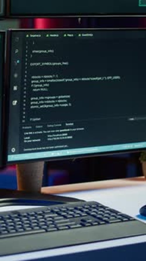 Vertical Video Close Up Shot of Dangerous Hacking Code Running on Computer System Monitors