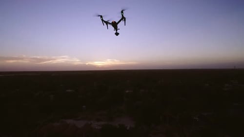 Aerial Drone Quad Copter Footage Flying Over Tropical Area And Towards The Sun.