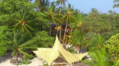 Aerial View Bamboo Bungalows with Thatched on White Sand Beach and Palm Trees Tropical Island Bora