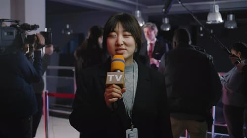Female Reporter Speaking at an Awards Event