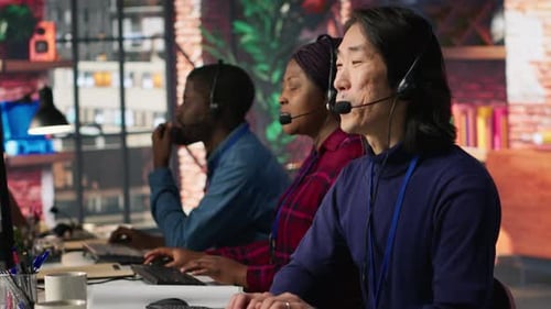 Multiethnic Team of Call Center Agents Answering Clients