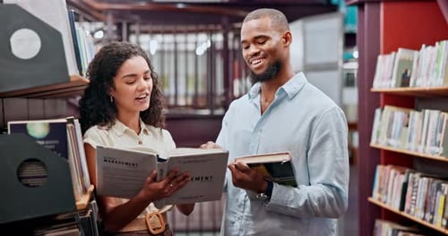 Man, woman and reading in university library for research, education and knowledge with team