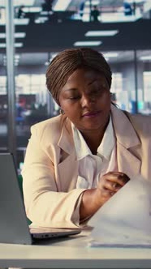 Vertical Video Determined Female CEO Analyzes Financial Reports and Develops a Growth Strategy
