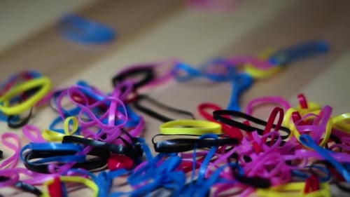 close up of rotating colorful rubber bands