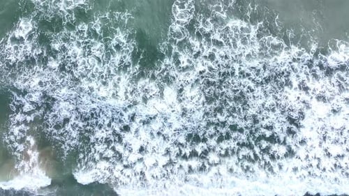 Sea Foam Rolling Under Drone View Drone Shot of Ocean Foam Foamy Waves Crashing From Above Aerial