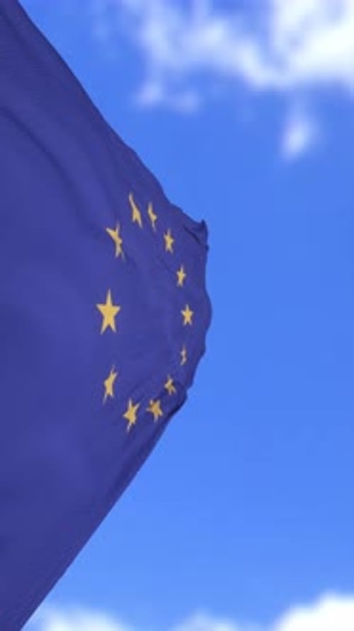 European Union Flag Waving Against a Clear Blue Sky