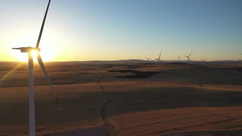 Aerial View Of Wind Power Plant At Sunset