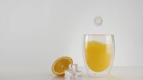Iced Orange Juice Refreshment on White Table