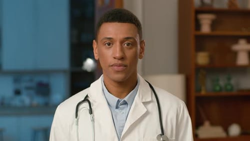 Young Doctor Wearing White Coat with Stethoscope