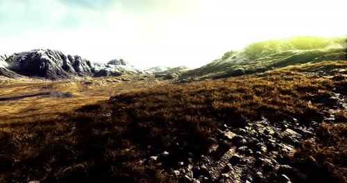 Drone Flight Over Arid Mountain Landscape at Sunrise