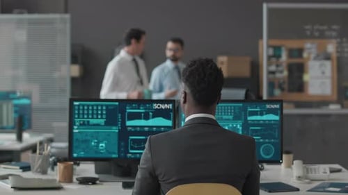Portrait of Black Male Cybersecurity Officer at Workplace