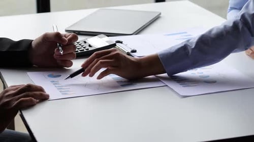 Analyzing Business Data and Charts on a Table