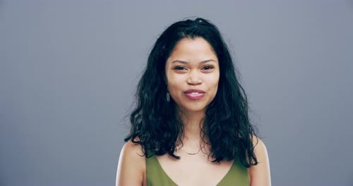 Young Woman Making Faces in Studio Portrait