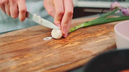 Cutting Green Onions on a Cutting Board