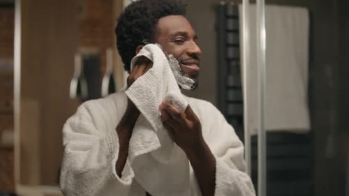 Man Drying Face with Towel After Shave