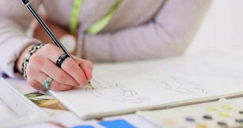 Fashion Designer Sketching Illustration on Paper